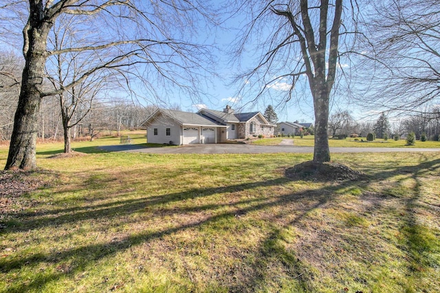 view of yard featuring a garage