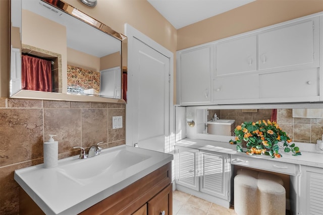 bathroom featuring vanity, tile walls, tile patterned floors, and decorative backsplash