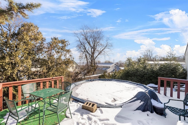 view of snow covered deck