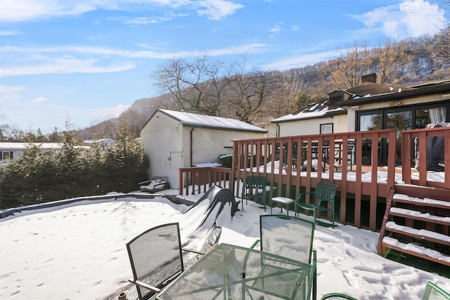 view of snow covered deck