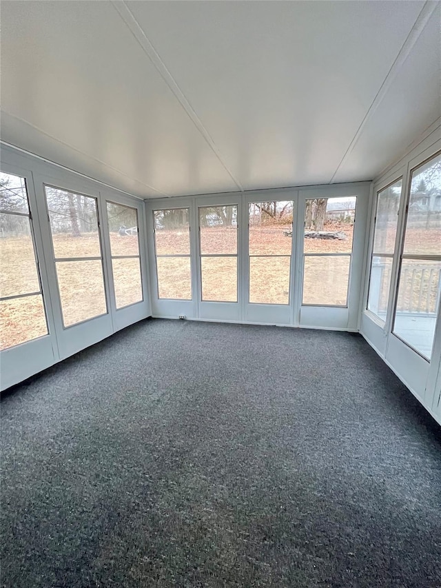 unfurnished sunroom featuring a wealth of natural light