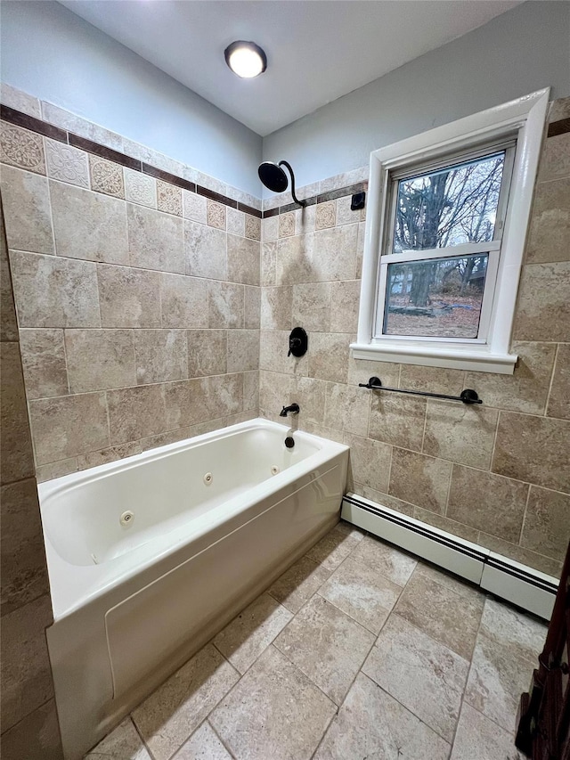 bathroom featuring baseboard heating and tiled shower / bath