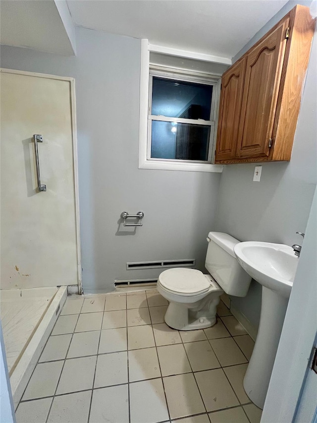 bathroom with walk in shower, tile patterned flooring, a baseboard radiator, and toilet