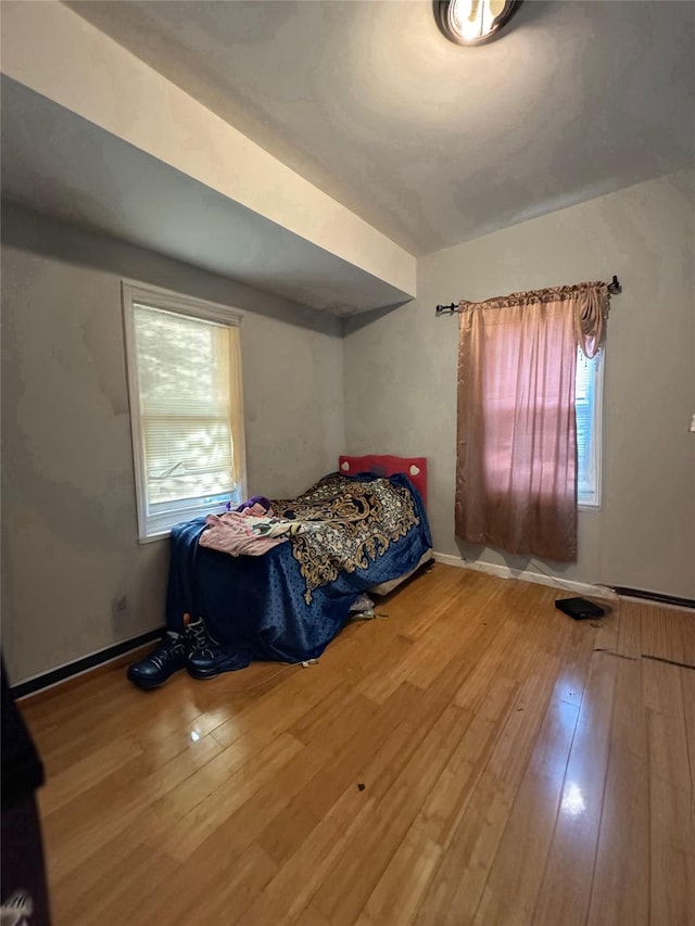 bedroom featuring wood-type flooring