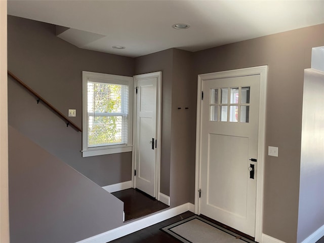 entrance foyer featuring dark hardwood / wood-style floors