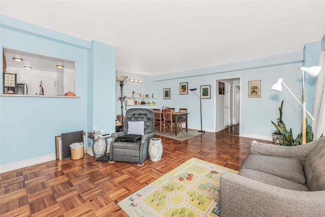 living room featuring parquet flooring