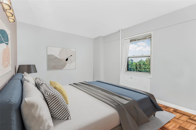 bedroom featuring parquet floors