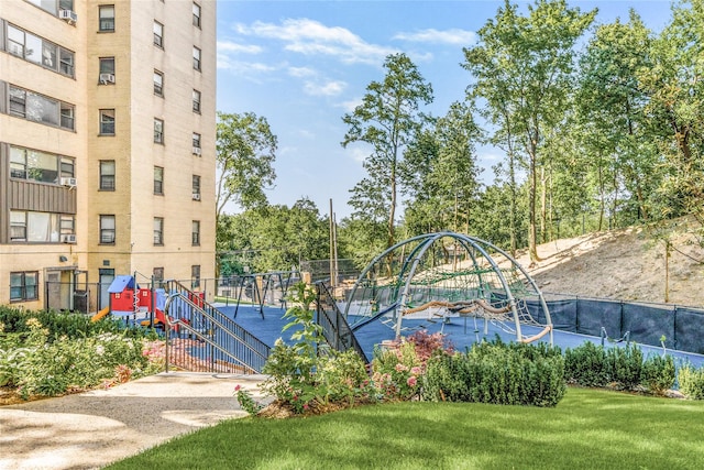 view of swimming pool featuring a playground