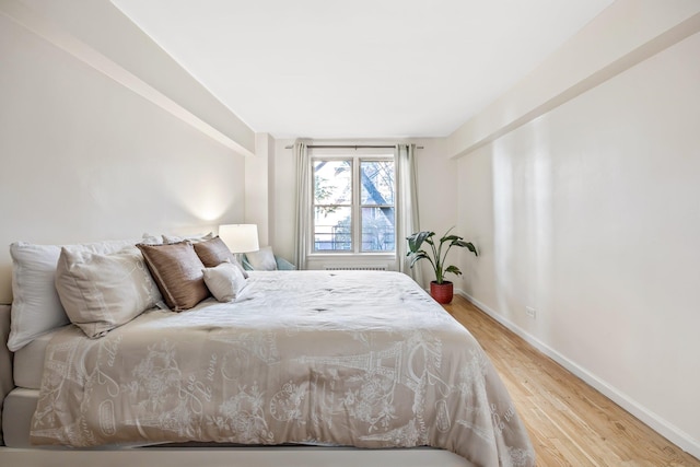 bedroom featuring wood-type flooring