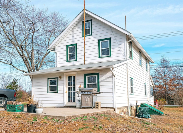 rear view of house with a patio