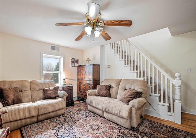 living room with ceiling fan and wood-type flooring