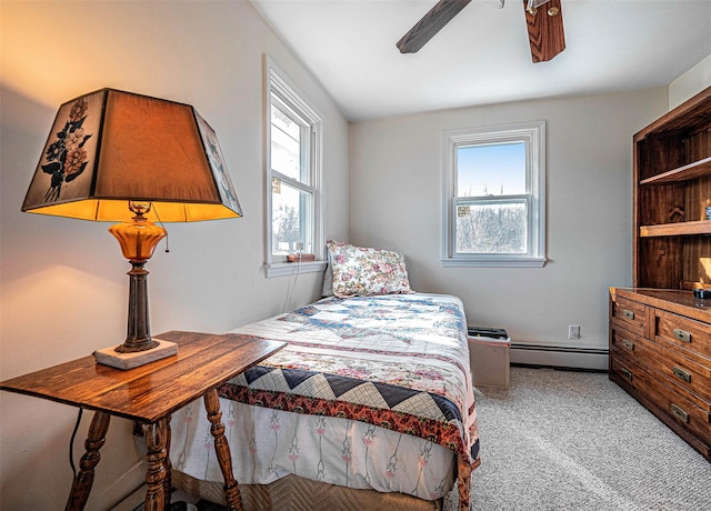 bedroom featuring ceiling fan, baseboard heating, and light carpet