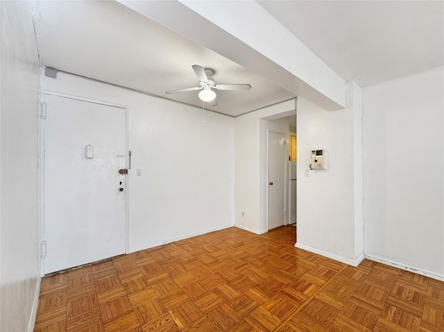 spare room featuring ceiling fan and light parquet floors