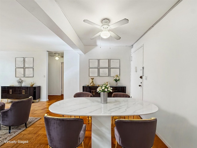 dining space with parquet floors