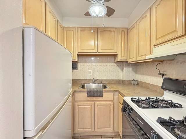 kitchen featuring ceiling fan, sink, tasteful backsplash, white appliances, and light brown cabinetry