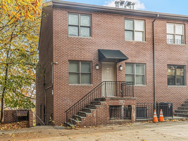 view of property featuring central AC unit