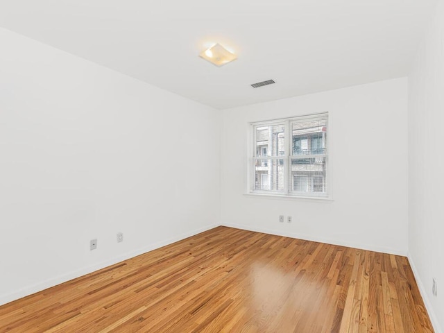 spare room featuring light hardwood / wood-style floors