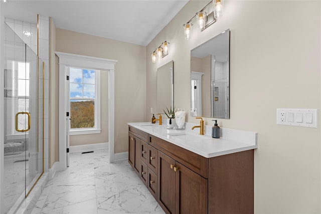 bathroom with vanity and a shower with shower door