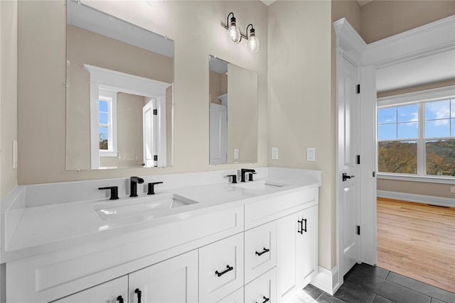 bathroom featuring hardwood / wood-style floors and vanity