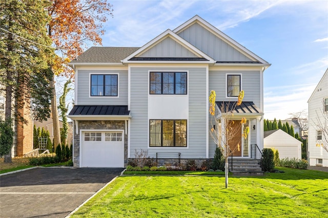 view of front of house with a front lawn and a garage