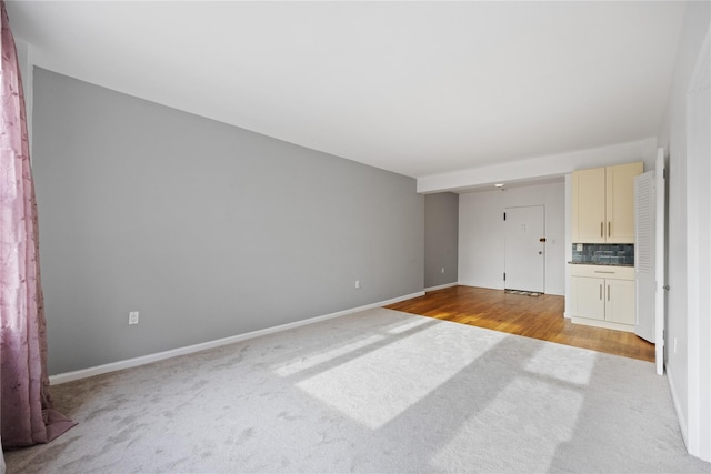 unfurnished living room with light hardwood / wood-style flooring