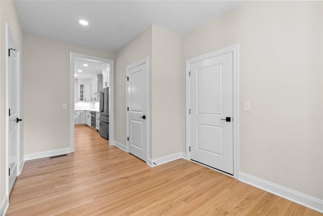 corridor featuring light wood-type flooring