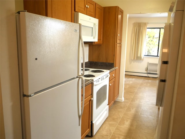 kitchen featuring white appliances and a baseboard heating unit