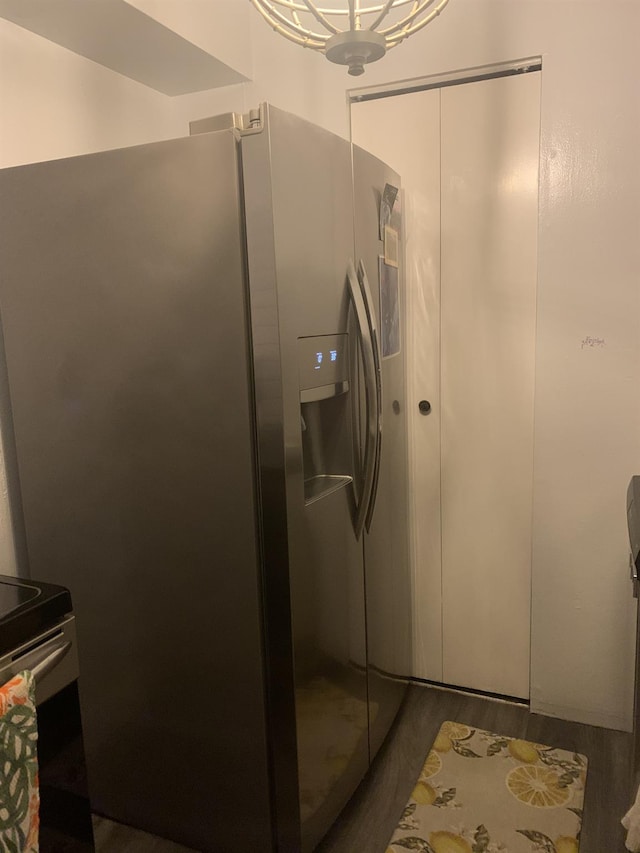 interior space featuring white cabinets, dark hardwood / wood-style flooring, and stainless steel fridge with ice dispenser