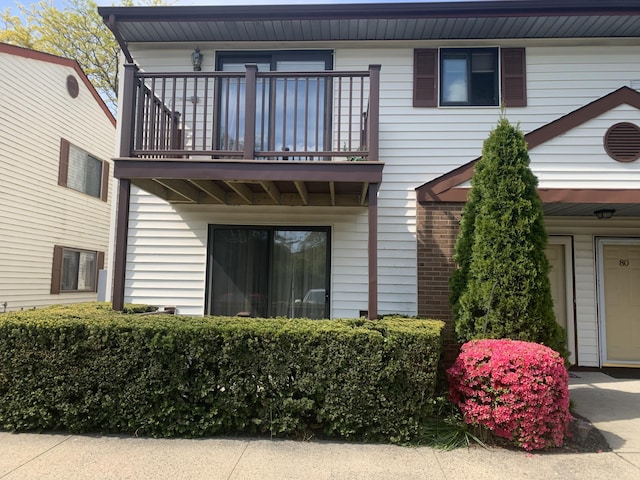 615 Broadway Unit 81, Amityville, NY 11701 - rear view of property featuring a balcony
