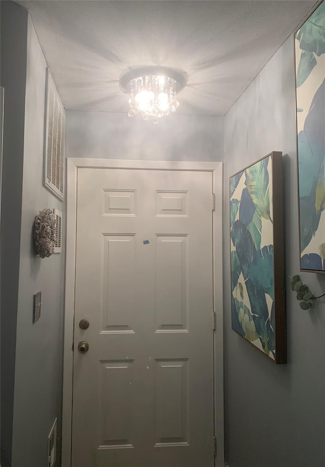 615 Broadway Unit 81, Amityville, NY 11701 - doorway with a chandelier