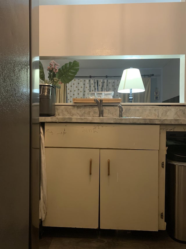 615 Broadway Unit 81, Amityville, NY 11701 - kitchen featuring freestanding refrigerator, white cabinets, and light countertops