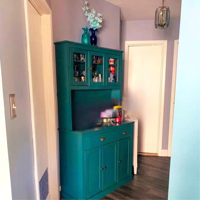 615 Broadway Unit 81, Amityville, NY 11701 - bar with dark wood-type flooring and baseboards