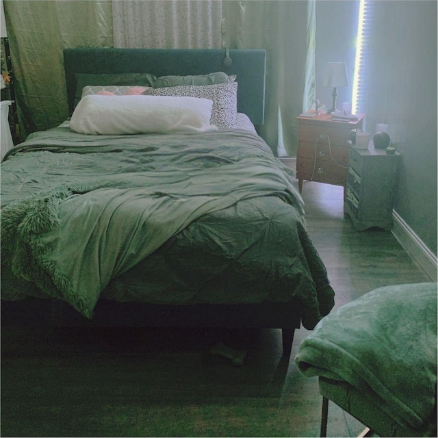 615 Broadway Unit 81, Amityville, NY 11701 - bedroom with baseboards and wood finished floors