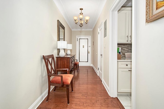 hall featuring a notable chandelier and wood-type flooring