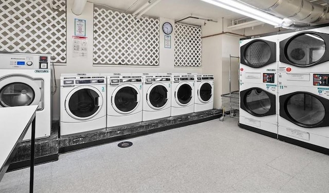 clothes washing area featuring independent washer and dryer and stacked washer and dryer