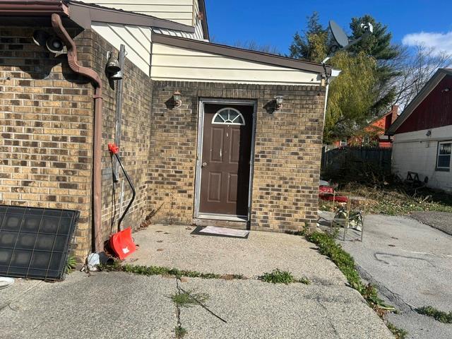 doorway to property featuring a patio