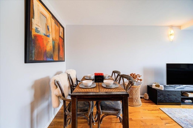 dining area with light wood-type flooring