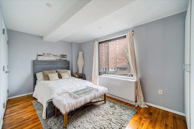 bedroom featuring wood-type flooring