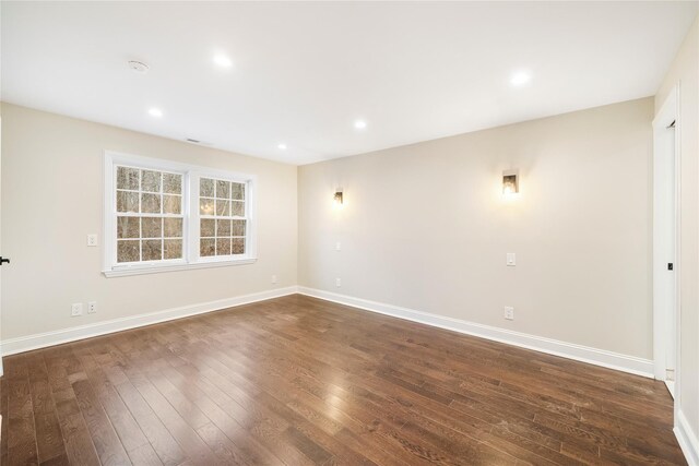 unfurnished room featuring dark hardwood / wood-style flooring