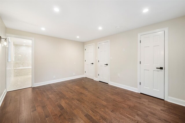 empty room featuring dark wood-type flooring