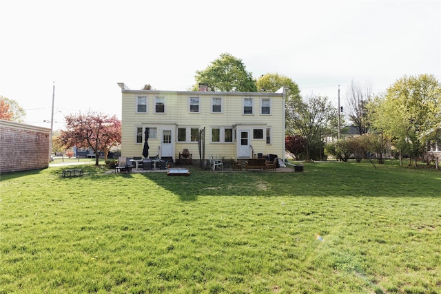 19-21 Moore Ave, Chatham, NY 12037 - rear view of property featuring a lawn, entry steps, and a chimney