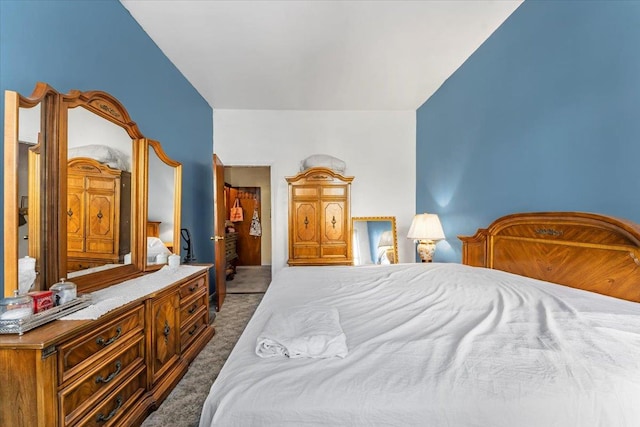 bedroom featuring dark colored carpet