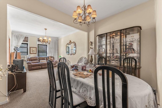 carpeted dining area with a notable chandelier