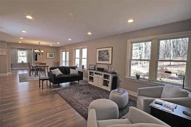 living room featuring hardwood / wood-style floors and a chandelier