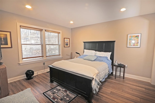 bedroom with dark hardwood / wood-style flooring