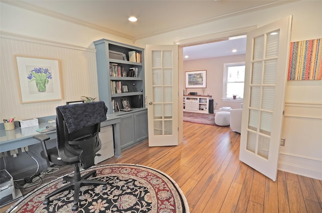 office area with crown molding, light hardwood / wood-style flooring, and french doors