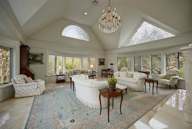 living room with a healthy amount of sunlight, high vaulted ceiling, and a chandelier