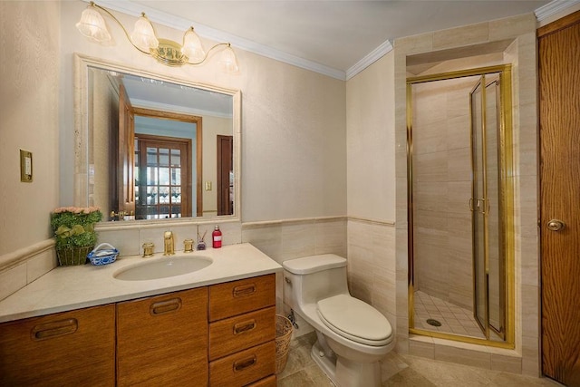 bathroom featuring vanity, toilet, an enclosed shower, and ornamental molding