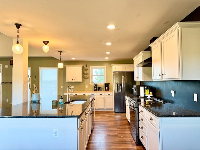 kitchen featuring white cabinetry, dark hardwood / wood-style flooring, decorative light fixtures, and appliances with stainless steel finishes