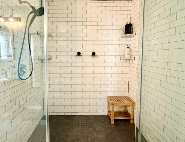 bathroom with a tile shower